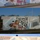 Illustration for article titled Artist repairs vandalized mural with giant QR code (that leads back to the pre-defaced artwork)